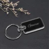 “Personalized oval metal keychain with custom name or logo engraving, ideal for professional branding or corporate gifting.”