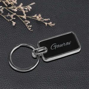 “Personalized oval metal keychain with custom name or logo engraving, ideal for professional branding or corporate gifting.”
