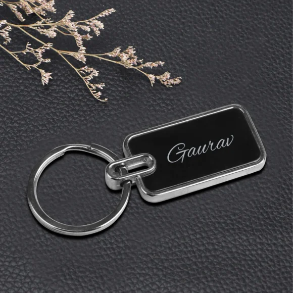 “Personalized oval metal keychain with laser-engraved name or logo, durable finish – ideal for gifting, branding, and professional use.”