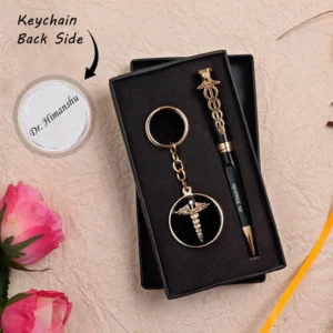 Personalized black and silver pen and keychain gift set for doctors, engraved with name and medical logo, elegant metal finish, packed in a premium gift box.