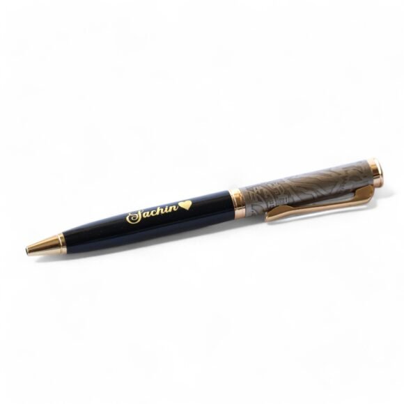 Personalized black and gold metal pen with gold flakes, custom name engraved, soft grip, blue ink – premium writing gift for professionals.