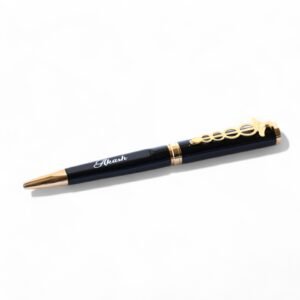 Custom engraved black and gold pen with gold flakes, soft grip, blue ink, ideal for gifting or personal use.