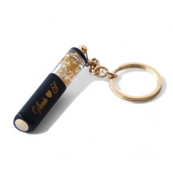 “Premium personalized metal pen with gold flakes, engraved with name, ideal corporate or personal gift for birthdays, graduations, weddings, and professionals like doctors or lawyers.”