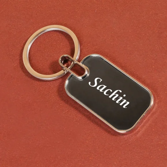 “Personalized oval metal keychain with custom name or logo engraving, ideal for professional branding or corporate gifting.”