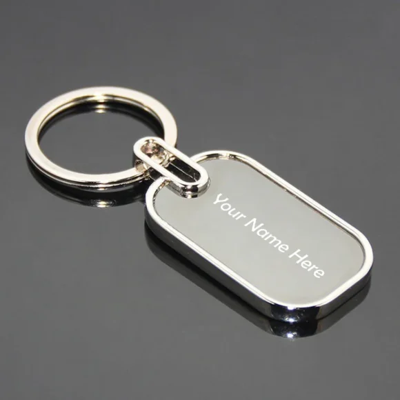 “Personalized oval metal keychain with custom name or logo engraving, ideal for professional branding or corporate gifting.”