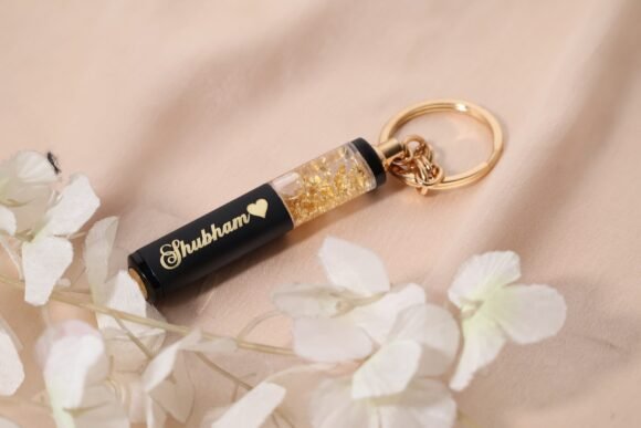 “Premium personalized metal pen with gold flakes, engraved with name, ideal corporate or personal gift for birthdays, graduations, weddings, and professionals like doctors or lawyers.”