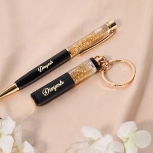 “Personalized gold flake pen and keychain set with name engraved, packed in a premium gift box – perfect for birthdays, corporate or personal gifting.”