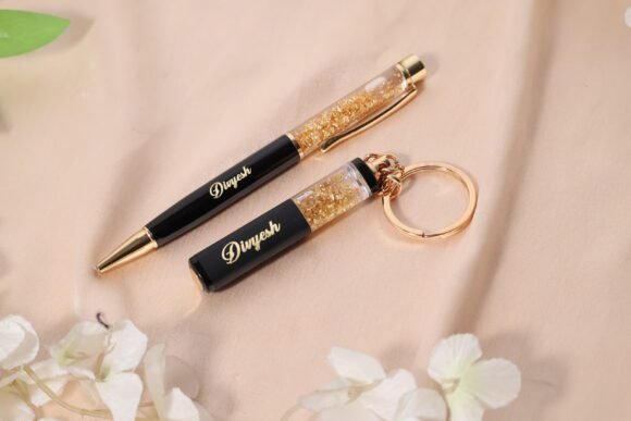 “Personalized gold flake pen and keychain set with name engraved, packed in a premium gift box – perfect for birthdays, corporate or personal gifting.”