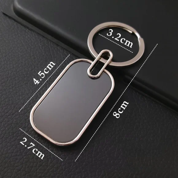 “Personalized oval metal keychain with custom name or logo engraving, ideal for professional branding or corporate gifting.”