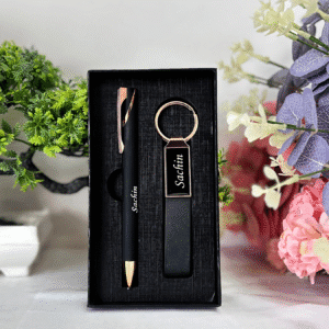 “Luxury matte black and rose gold pen and keychain gift set in premium grey presentation box – elegant gift for professionals or corporate use.”