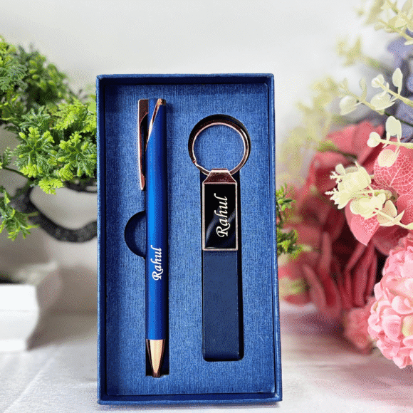 “Luxury matte black and rose gold pen and keychain gift set in premium grey presentation box – elegant gift for professionals or corporate use.”