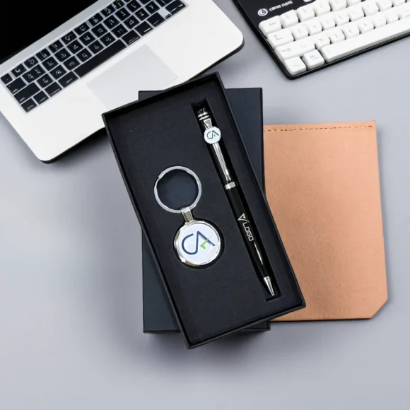 Personalized black and silver pen and keychain gift set for Chartered Accountants with engraved name and CA logo, presented in a premium gift box – ideal professional gift.