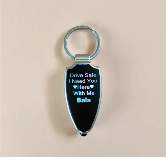 “Drive Safe LED keychain in multicolor with custom name engraving, compact design for bike, car, or couple key holders – ideal gift with LED light feature.”