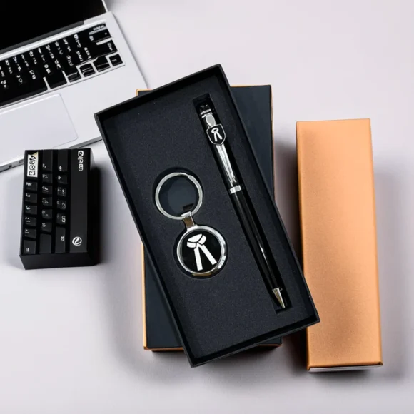 Black and silver personalized pen and keychain set for lawyers or advocates, engraved with name and legal logo, presented in an elegant gift box